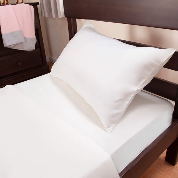 Bed with white mattress and pillow