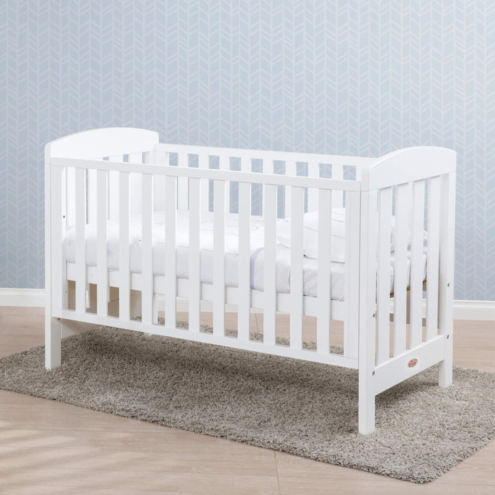 Alice cot bed placed under a rag