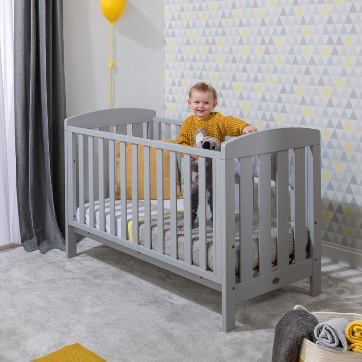 Kid inside the Alice Cot Bed
