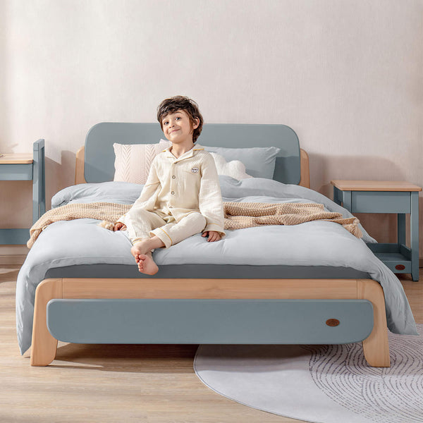 Kid sitting on the Avalon Double Bed