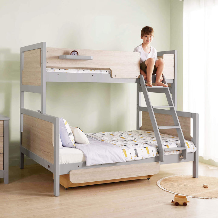 kid sitting on the top bunk