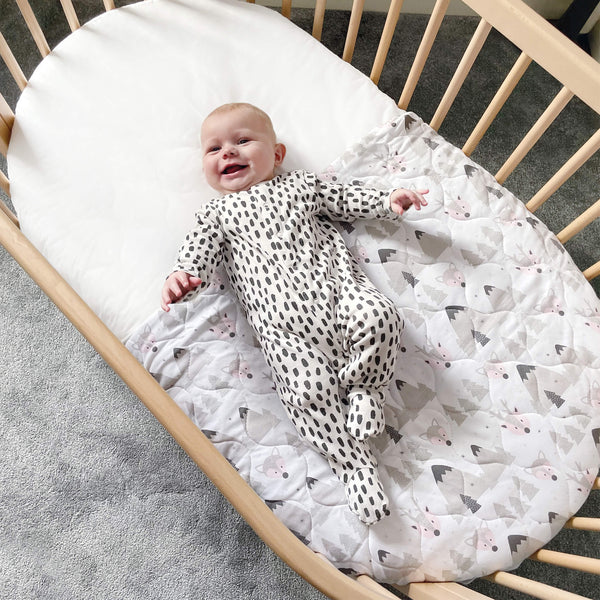 Baby lying on crib