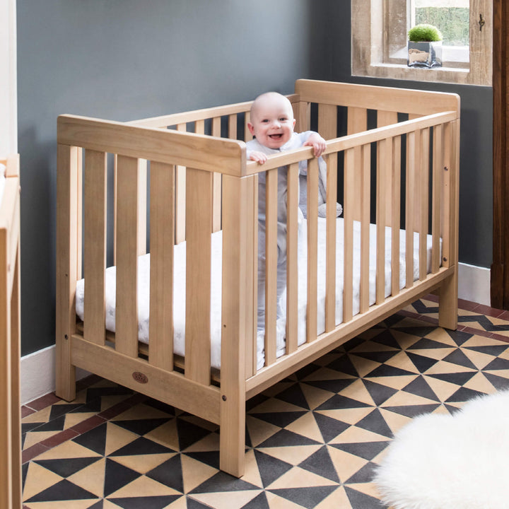 baby inside Dropside Cot Bed