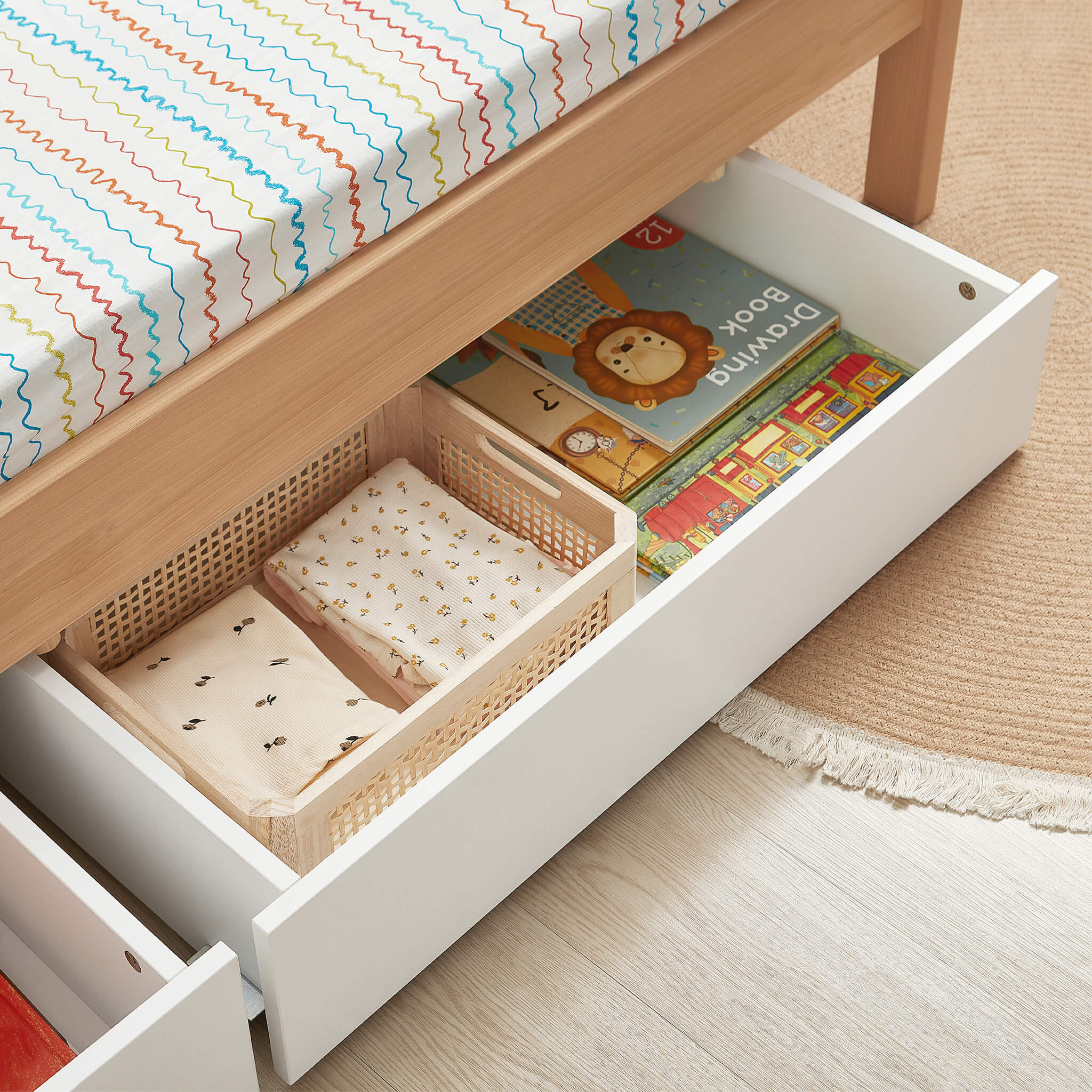 Cot bed with outlet under drawer storage