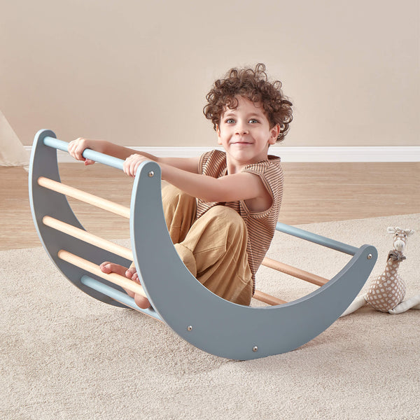 Child sitting on the Tidy Climbing Arch