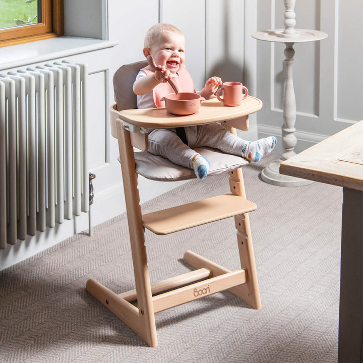 Baby sitting on the Tidy Highchair