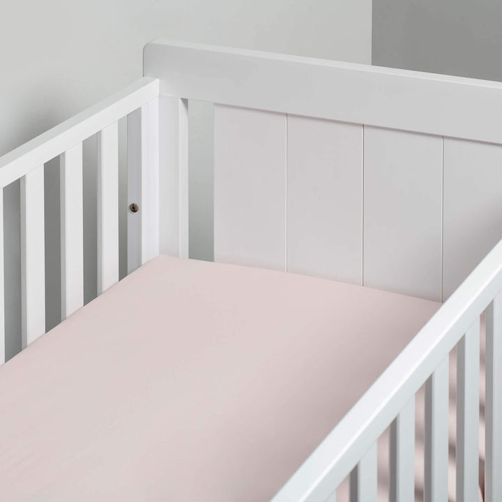 pink fitted sheet in cot bed