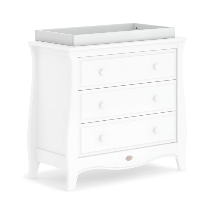 white changing tray on top of sleigh chest of drawers