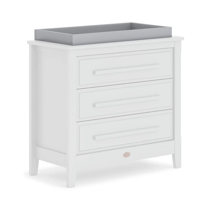 grey changing tray on chest of drawers