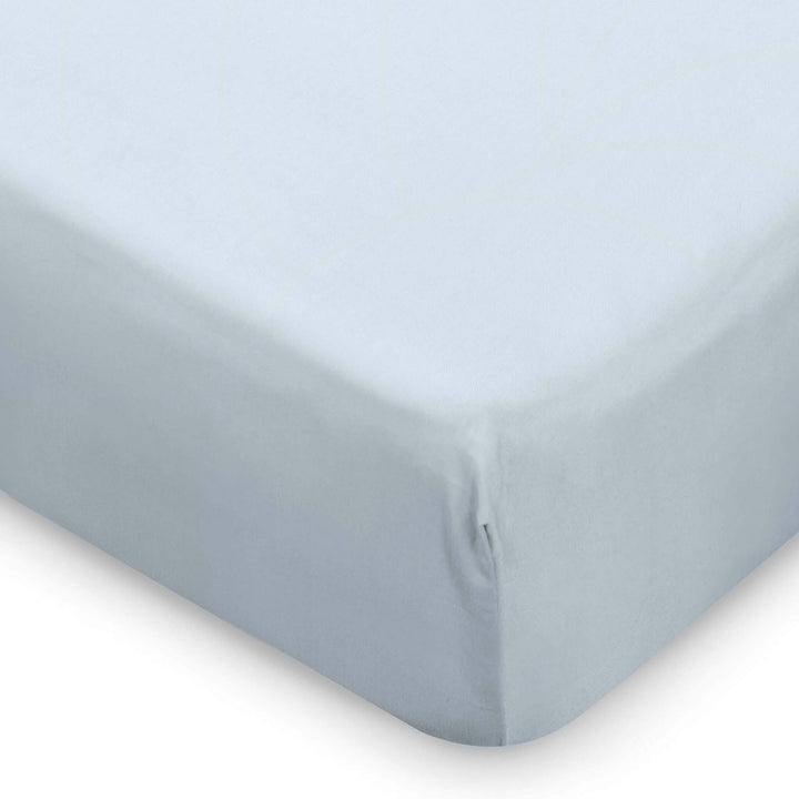 corner of blue cot bed fitted sheet